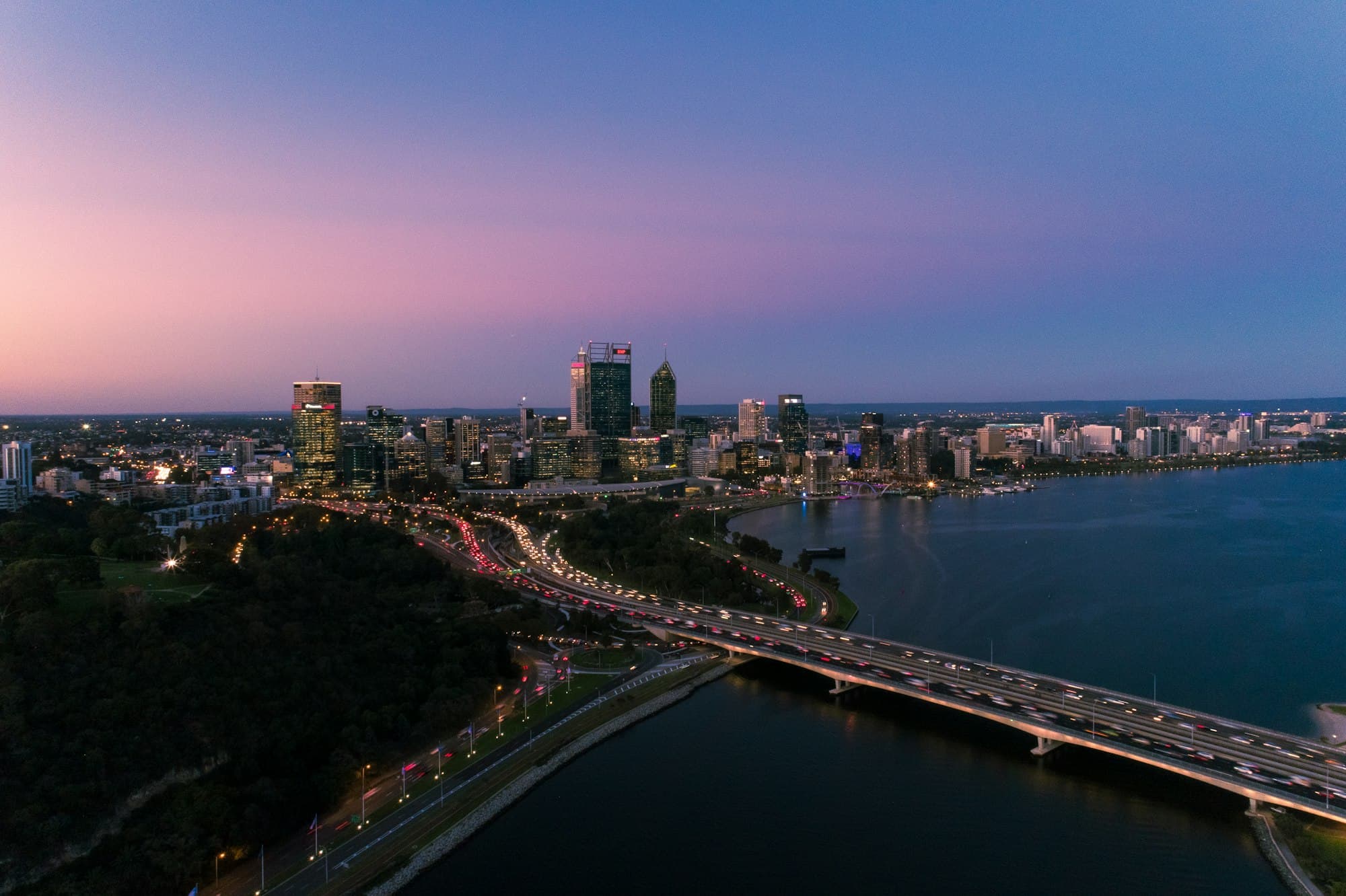 The Perth city skyline at dusk, across the Swan River from Mill Point.